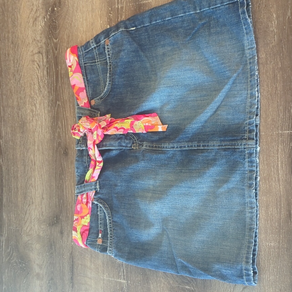 Super cute and trendy jean skirt with scarf belt included